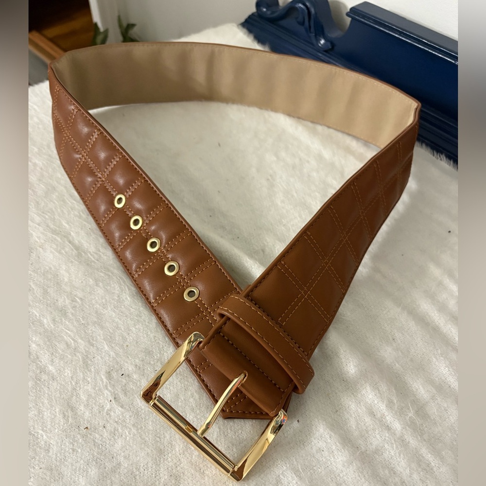 Cognac belt has the Quilted Leather Belt with Gold Buckle Size Medium. NWT